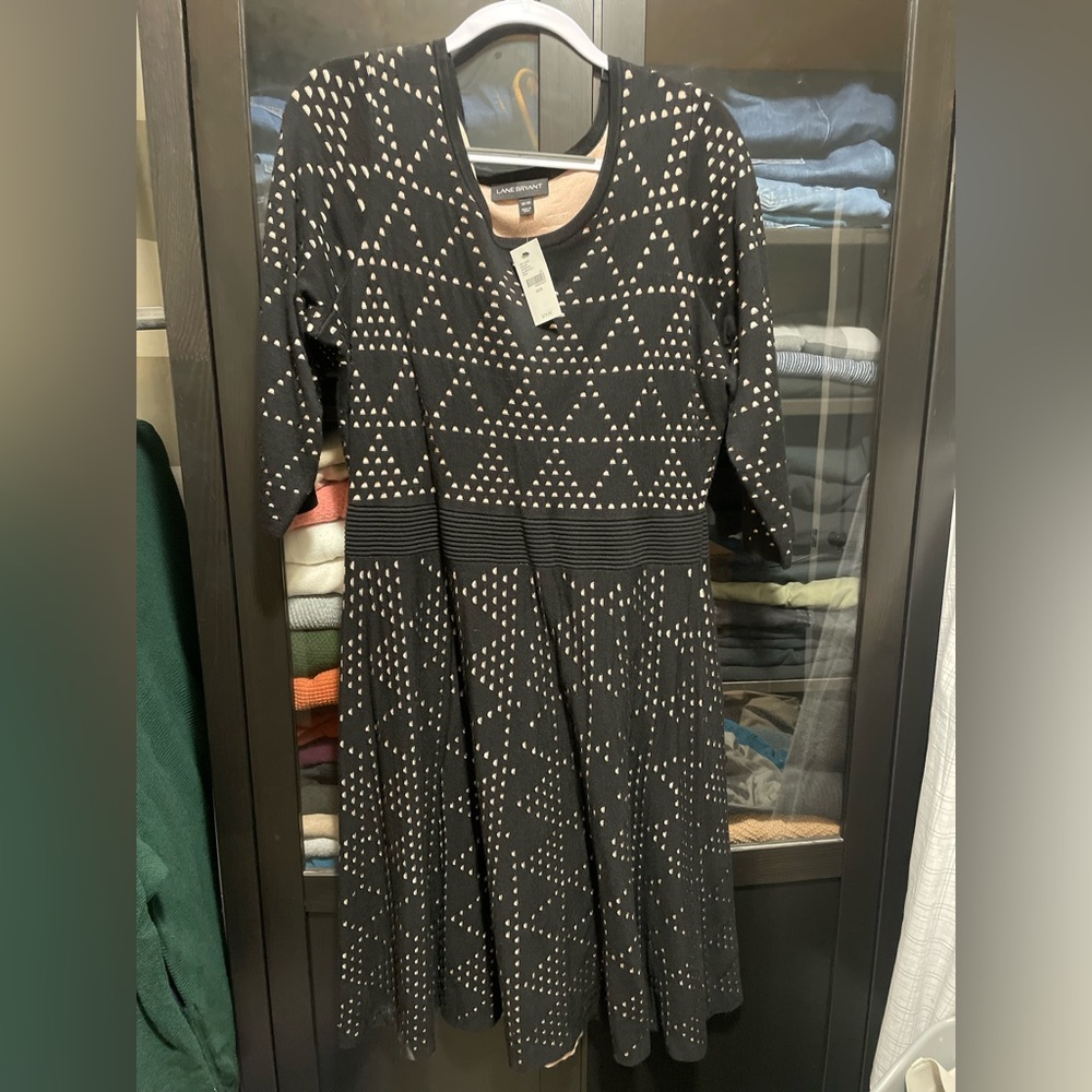 Super cute black sweater dress with nude underlay.